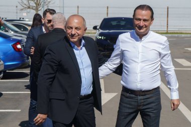 Bucharest, Romania. 3rd Apr, 2024: Catalin Cirstoiu (L), the joint candidate for mayor of Bucharest of the Social Democratic Party (PSD) and the National Liberal Party (PNL), is greeted by Daniel Baluta (R), the mayor of Sector 4, upon arrival at the clipart
