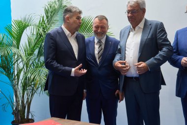 Bucharest, Romania. 5th Apr, 2024: (L-R) Marcel Ciolacu, PSD president, Paul Stanescu, PSD general secretary and Mihai Tudose, PSD MEP, submit the PSD PNL Alliance list of candidates for the MEPs elections, at the Central Electoral Bureau. clipart