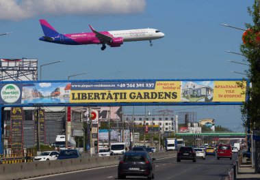 Otopeni, Romania. 8th Apr, 2024: Flight Stockholm to Bucharest, W43202, of the low cost airline Wizz Air lands at Bucharest Henri Coanda International Airport (AIHCB), over the National Road no. 1 in Otopeni, 16.5 km north of Bucharest. Romania and clipart