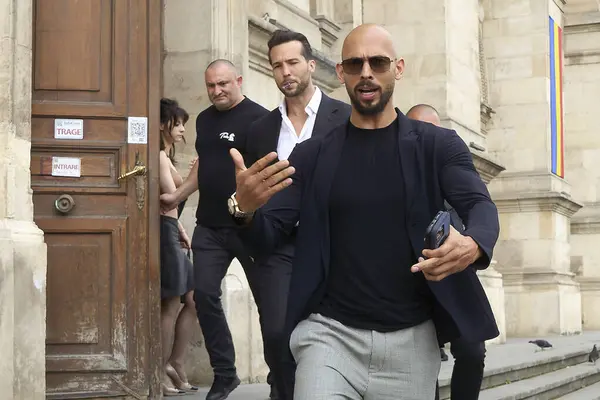 stock image Bucharest, Romania. 30th May, 2024: Andrew Tate (R) and his brother Tristan Tate (C) leave the Bucharest Court of Appeal.