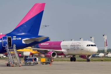 Otopeni, Romania. 2nd Aug, 2024: An aircraft of the low cost airline Wizz Air taxiing for take-off at Bucharest Henri Coanda International Airport (AIHCB), in Otopeni, 16.5 km north of Bucharest. clipart