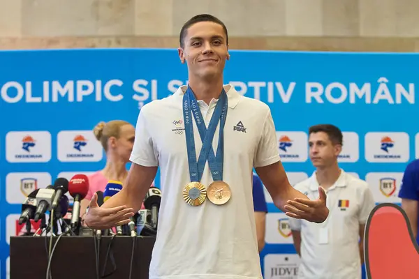 stock image Otopeni, Romania. 2nd Aug, 2024: Romanian Olympic gold medalist swimmer David Popovici returns from Olympic Games Paris 2024 at Bucharest Henri Coanda International Airport, in Otopeni, Romania. Popovici won the gold medal in the men's 200m freestyle