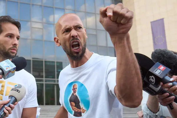 Stock image Bucharest, Romania. 22dn Aug, 2024: Andrew Tate (R) and his brother Tristan Tate (L) leave the Bucharest Court, Andrew under house arrest and Tristan under judiciary control, after being held in custody for 24 hours. 