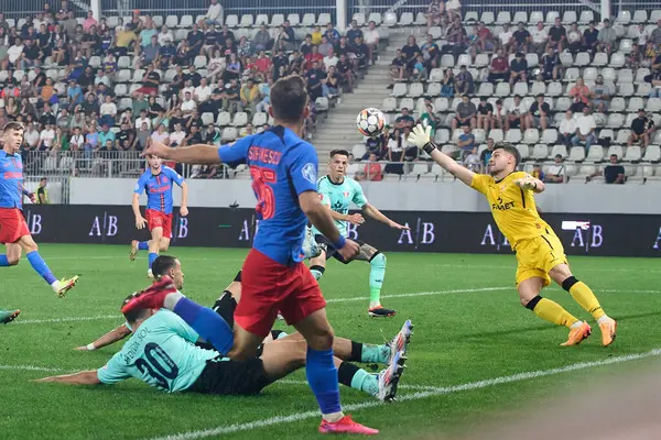 stock image Bucharest, Romania. 1st Sep, 2024: Robert Popa (R), UTA goalkeeper, saves a ball during the football match between FCSB and UTA Arad in the 8th round of Superliga, the first league of the Romanian 2024-2025 football championship, at the Arcul de Triu