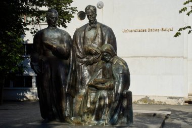 Cluj-Napoca, Romania. 20th Sep, 2024: The Ardelean School statuary group (1973) near Babes-Bolyai University, work of the sculptor Romulus Ladea, (L-R) Petru Maior, Gheorghe Sincai and Samuil Micu. clipart