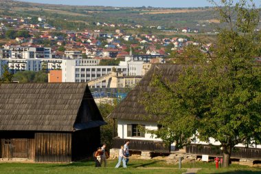 Cluj-Napoca, Romania. 21th Sep, 2024: Dambu round neighborhood can be seen behind the potter house from Josenii Bargaului village, Bistrita-Nasaud county, in Romulus Vuia National Ethnographic Park. clipart