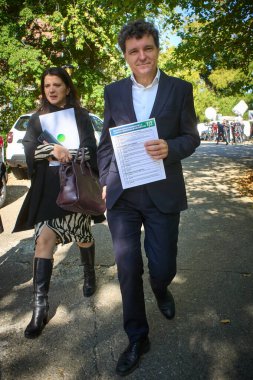 Bucharest, Romania. 18th Oct, 2024: Nicusor Dan, the Mayor of Bucharest, leaves after the meeting with Nicolae Ciuca (not in picture), National Liberal Party (PNL) president and candidate for the Presidency of Romania, holding his 20 requests list, s clipart