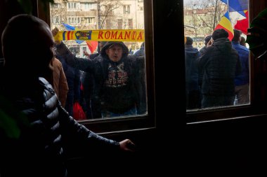 Bucharest, Romania. 30th Dec, 2024: Supporters of Calin Georgescu, winner of the first round of the presidential election, annulled by the CCR, protests in front of the Bucharest Court of Appeal. clipart