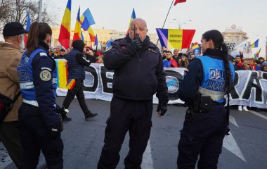 Bucharest, Romania. 13th Jan, 2025: Colonel of Gendarmerie Marius Velicu (C) during the far-right AUR party protest against the Constitutional Court's decision to cancel the presidential elections. clipart