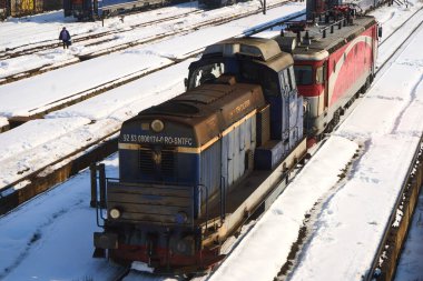 Bucharest, Romania. 20th Feb, 2025: Locomotives on the railway infrastructure at the Grivita Railway Workshops. clipart