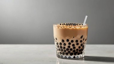 Creamy milk tea with chewy black tapioca pearls clipart