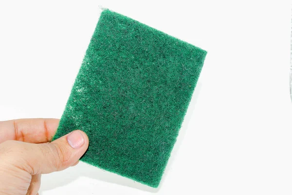 白い背景に細い繊維が隔離された緑の手スクラバー — ストック写真