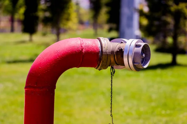 Red fire hydrant close-up in a park in the city. Fire safety in Ankara