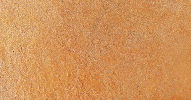 Grafik tasarımı veya duvar kağıdı için eski turuncu çimento duvar arka planı. Beton zemin eski bir konsepte göre yaşlanmış. Sunumlar veya kartpostallar için geçmişe dönük şablon.