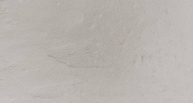 Çimento duvar arkaplanı. Grafik tasarımı ya da eski duvar kâğıdı için klasik tarzda boyanmamış. Eskimiş dokusu olan beton desen. Kırsal bölgelerde çatı katı tipi duvarcılık bulundu.