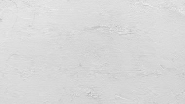 Beyaz beton duvar retro konseptte. Duvar kağıdı ya da grafik tasarımı için eski beton arka plan. Vintage tarzda boş alçı dokusu. Sakin ve basit hissettiren modern iç mekanlar..