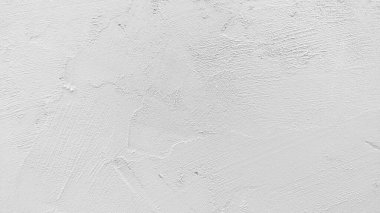 Beyaz beton duvar retro konseptte. Duvar kağıdı ya da grafik tasarımı için eski beton arka plan. Vintage tarzda boş alçı dokusu. Sakin ve basit hissettiren modern iç mekanlar..
