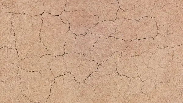 Zemin, kuraklık ve ölüm kavramına sahip arka plan veya grafik tasarımı için üst görünümde çatlaklar var..