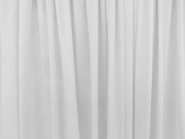 Grafik tasarımı veya duvar kağıdı için yumuşak beyaz perde arka planı. Tiyatro konseptinde klasik tarzda yumuşak dalgalarla lüks bir fon..