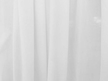 Grafik tasarımı veya duvar kağıdı için yumuşak beyaz perde arka planı. Tiyatro konseptinde klasik tarzda yumuşak dalgalarla lüks bir fon..