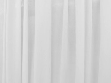 Grafik tasarımı veya duvar kağıdı için yumuşak beyaz perde arka planı. Tiyatro konseptinde klasik tarzda yumuşak dalgalarla lüks bir fon..