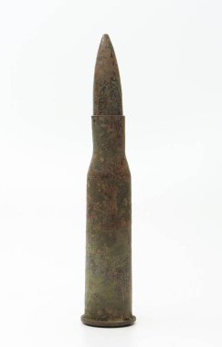 Old rifle cartridge on a white background.