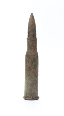 Old rifle cartridge on a white background.
