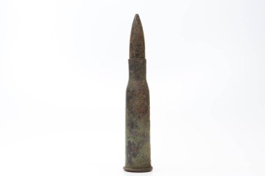 Old rifle cartridge on a white background.