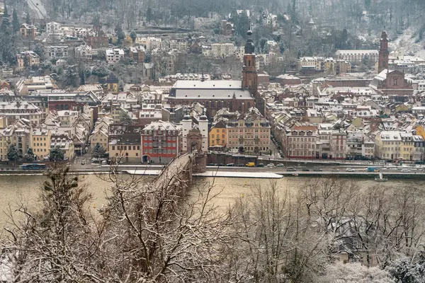 walking through the streets of Heidelberg with snow and river view, path of the philosophers