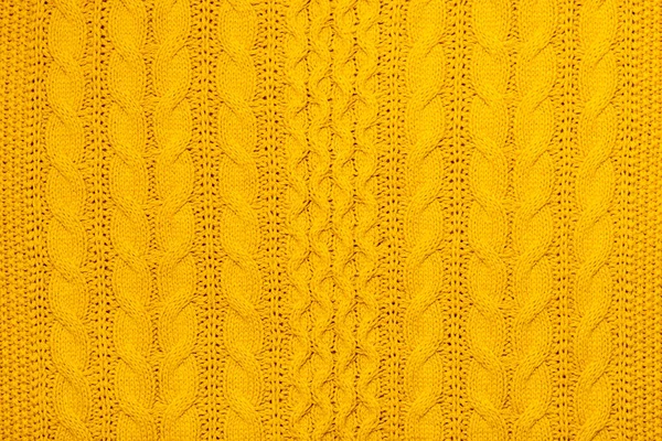 テクスチャジャージやセーターやスウェットシャツの編み物の明るい黄色のマクロ写真 ファッションのパターンと背景暖かい秋のコンセプト — ストック写真