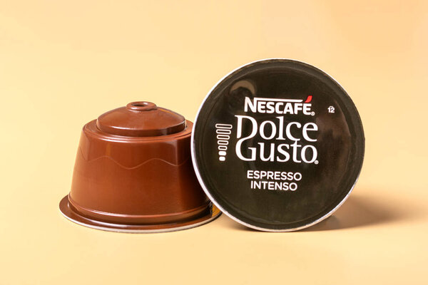 October 2023, Milan, Italy Set of Nescafe Dolce Gusto coffee capsules isolated on white background Top view Flat lay Drink obtained from dosed capsule with roasted, ground, compressed natural coffee.
