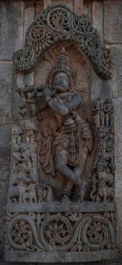 Intricate carvings and sculptures of the Hoysala temples in Belur, India. clipart