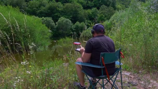 Artist Practice Pads Headsets Practicing Outdoors Mountain Lake Drum Practice — Stock Video