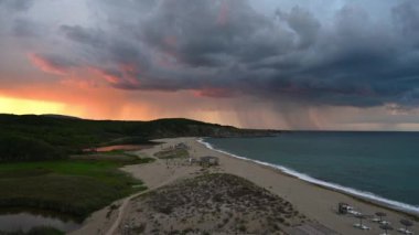 Video with an empty wild beach at sunset. Panoramic sunset video with one of the most beautiful and wild beaches at the Black Sea coast and the estuary of Veleka river, Bulgaria.