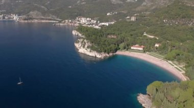 Aerial video of the picturesque Adriatic coastline near the city of Budva, Montenegro.