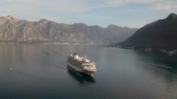 Aerial Video Large Cruise Ship Passing Beautiful City Perast Leaving — Stockvideo