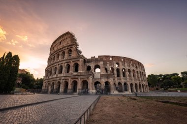 Amazing view of the Colosseum at beautiful warm light at sunrise, Rome, Italy.	