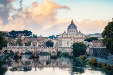 Beautiful colorful morning view of Rome Skyline with the famous Vatican Saint Peter Basilica and Saint Angelo Bridge above Tiber River in Rome, Italy.	