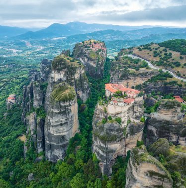 Amazing panoramic view with Varlaam Monastery, Monastery of Great Meteoron and Monastery of St. Nikolaos in the Meteora Valley near Kastraki, Greece.	