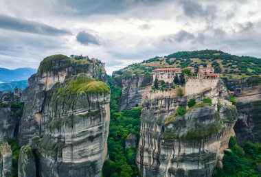 Amazing panoramic view with Varlaam Monastery and Monastery of Great Meteoron in the Meteora Valley near Kastraki, Greece.	