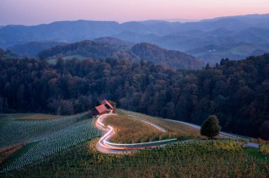 Amazing night landscape with the famous heart-shaped road, outlined by traffic lights, near Maribor and close to the Austrian border in Slovenia clipart