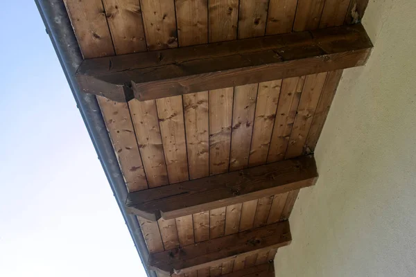 the pitch of a roof with wooden beams. High quality photo