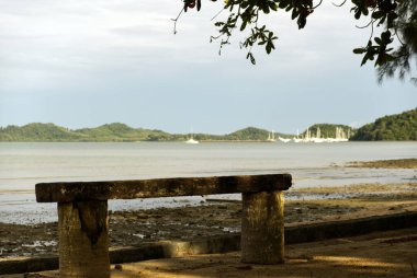 Wooden swing chair near the ocean in Asia. High quality photo clipart