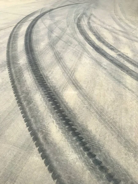 Traces of car tires on the road