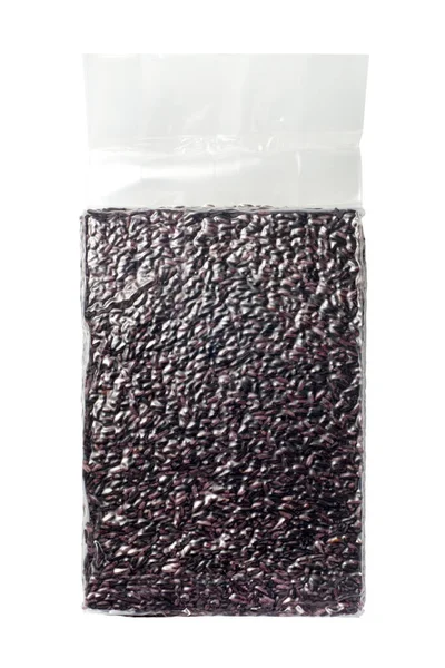 stock image Purple rice in transparent vacuum sealed bag. Isolated on white background.