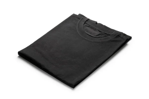 白い背景に隔離された黒の折り畳まれたTシャツ ストック写真