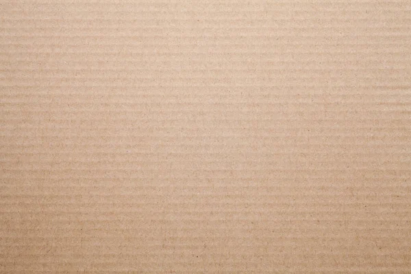 Sheet of brown corrugated paper texture background