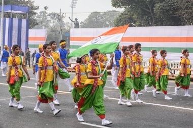 Students with Indian flag preparing for taking part in the upcoming Indian Republic Day parade at Indira Gandhi Sarani, Kolkata, West Bengal, India on January 2023