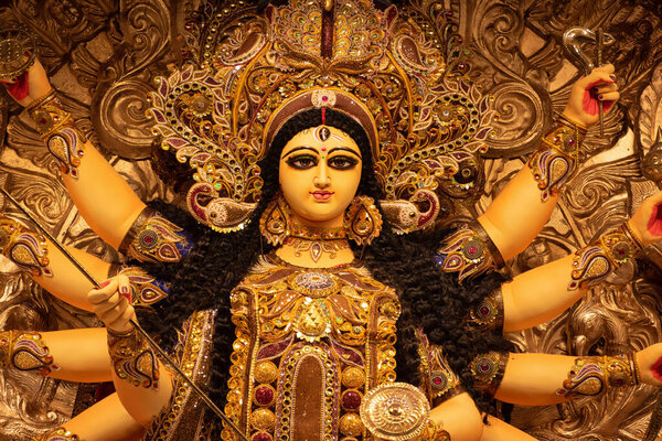 Goddess devi Durga idol decorated at a puja pandal in Kolkata, West Bengal, India. Durga Puja is one of the biggest religious festivals of Hinduism and is now celebrated worldwide.