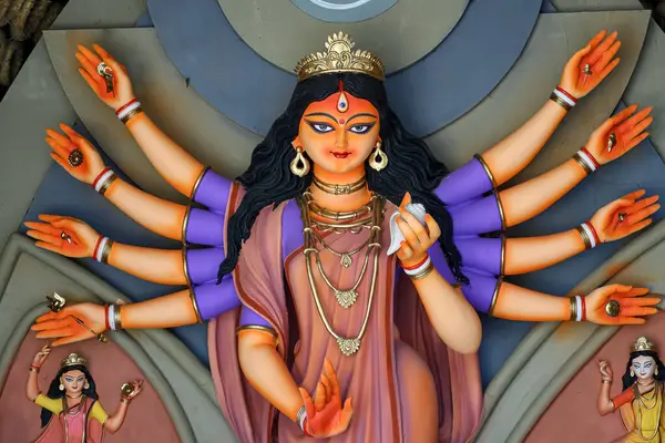 stock image Idol of Goddess Devi Durga at a decorated puja pandal in Kolkata, West Bengal, India. Durga Puja is a famous and major religious festival of Hinduism that is celebrated throughout the world.